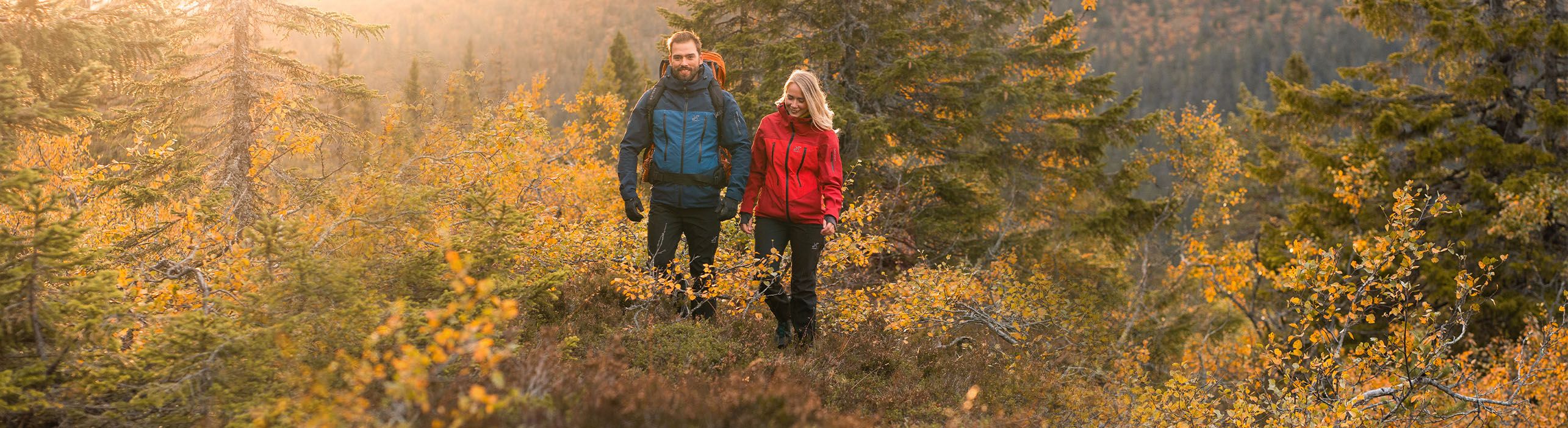 man and woman hiking in the fall.jpeg
