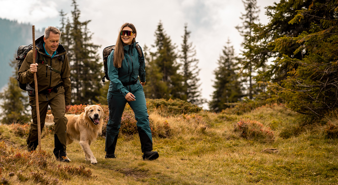 man and woman hiking with dog.jpg